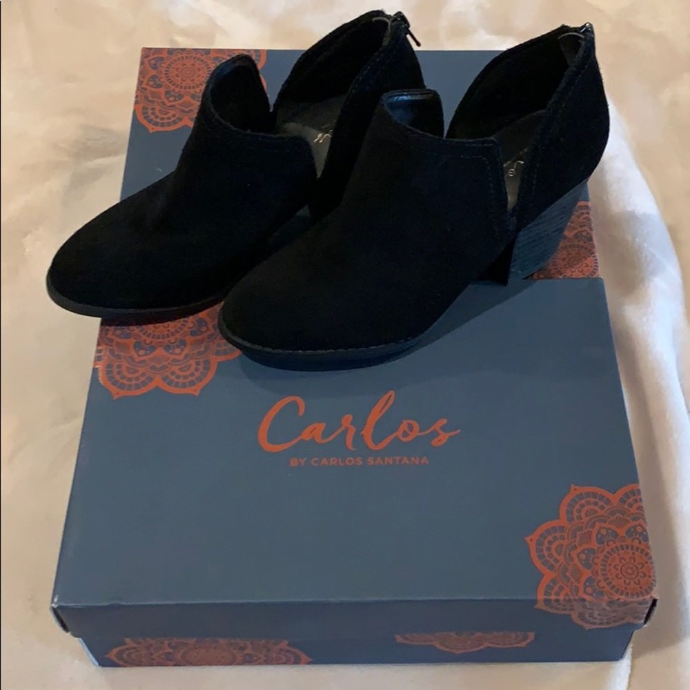 Carlos Santana black heeled booties.
